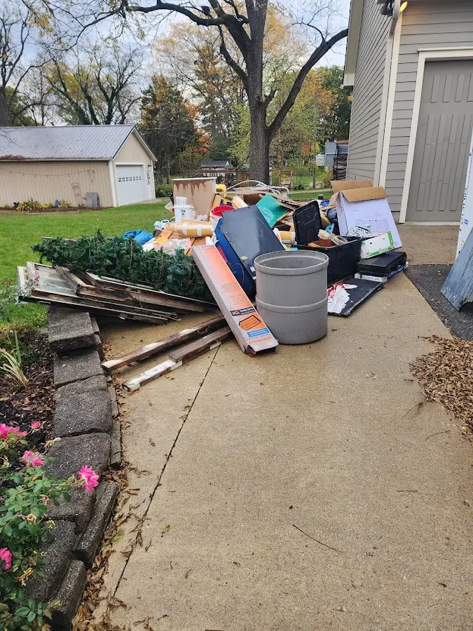 Dumpster being loaded with debris for Residential Dumpster Rental in Sultan